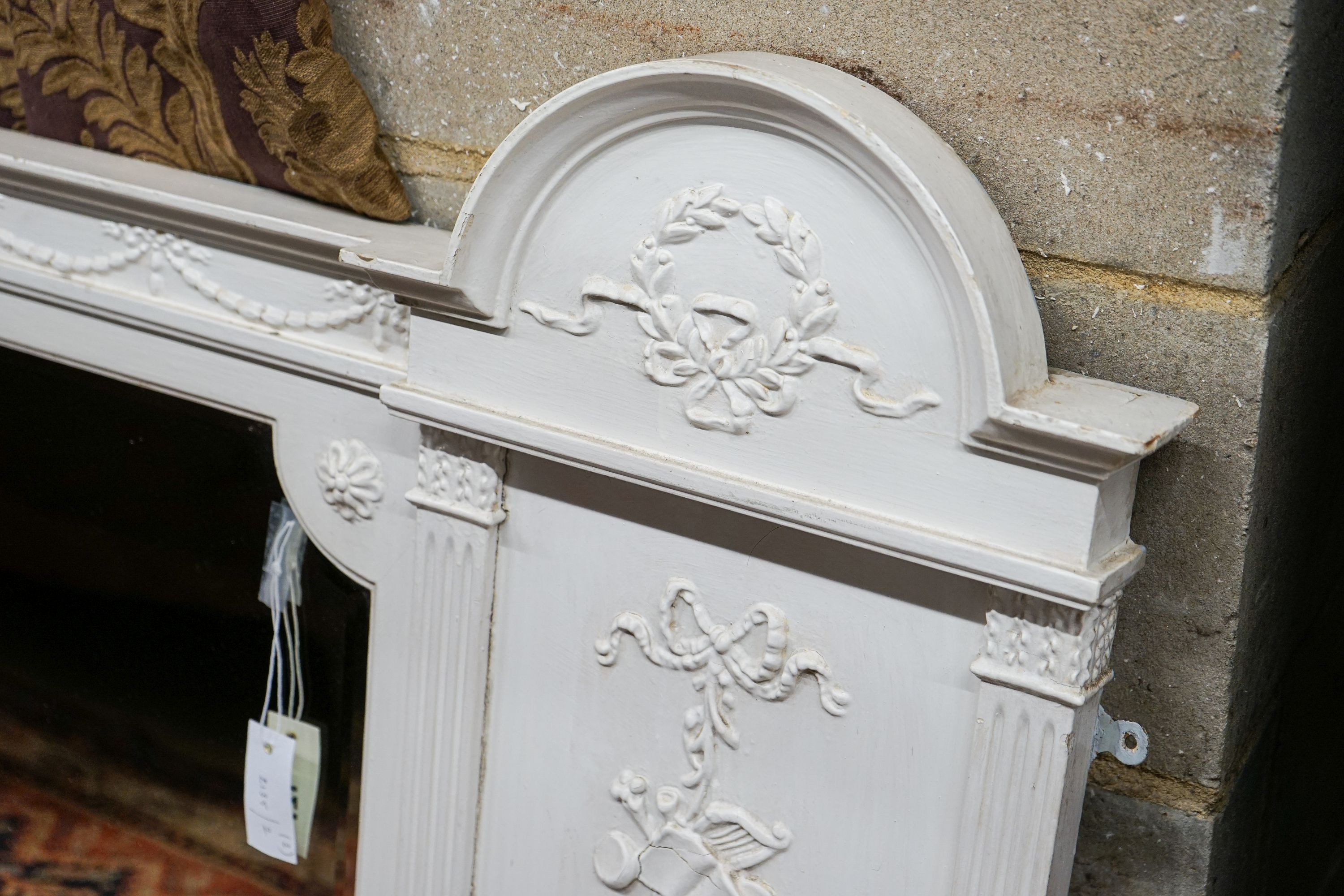 A Victorian later painted overmantel mirror, width 143cm, height 76cm together with a painted and mirrored overmantel